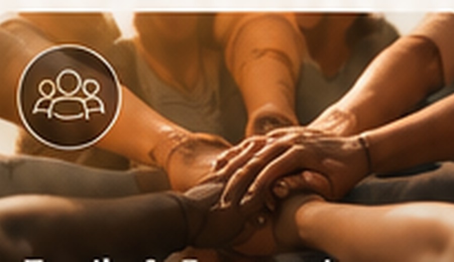People placing their hands together in a moment of connection and shared work.